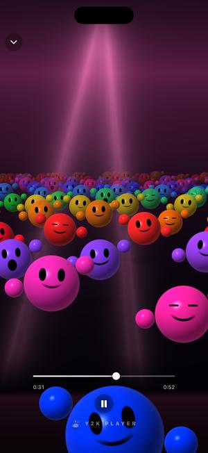 The Crowd visualizer: rows of smiling coloured spheres packed together under pink stage beams, hands going up in a wave.