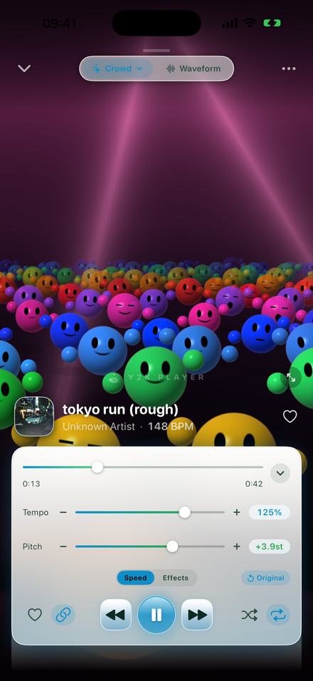 The speed panel at Tempo 125% and Pitch +3.9st on a track called "tokyo run (rough)" at 148 BPM, over a visualizer of glossy smiling spheres lit by three beams.